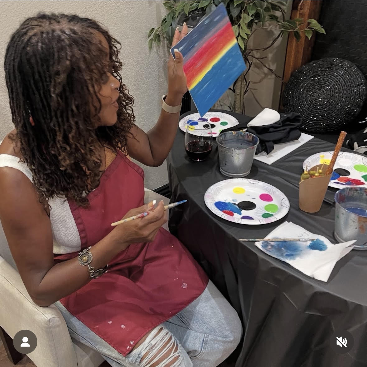 Guest showing off her painting at HEIR Paint and Sip
